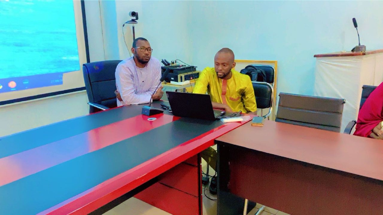 Workshop participants reviewing project progress.