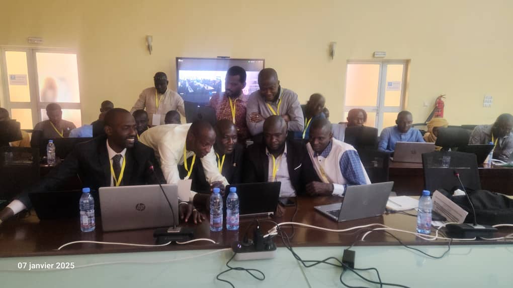 Workshop participants following the training materials.